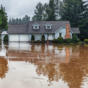 Residential house with street heavily flooded after a storm